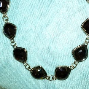 3-8-77 beautiful smokey colored shiny stones set in silvertone